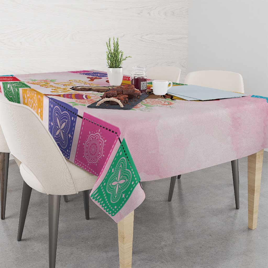 Pink tablecloth with colorful bandana squares and horse graphic draped on dining table