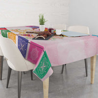 Pink tablecloth with colorful bandana squares and horse graphic draped on dining table