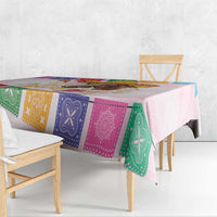 Pink tablecloth corner with colorful bandana stripe blocks and horse graphic detail