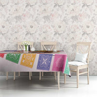 Pink tablecloth with colorful bandana panel print and horse sombrero design on dining table