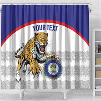 Shower curtain on tub feet: blue band, jaguar graphic, crest badge, and 'YOUR TEXT'