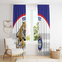 Blue and white window curtains with jaguar mascot and crest graphic centered on both panels