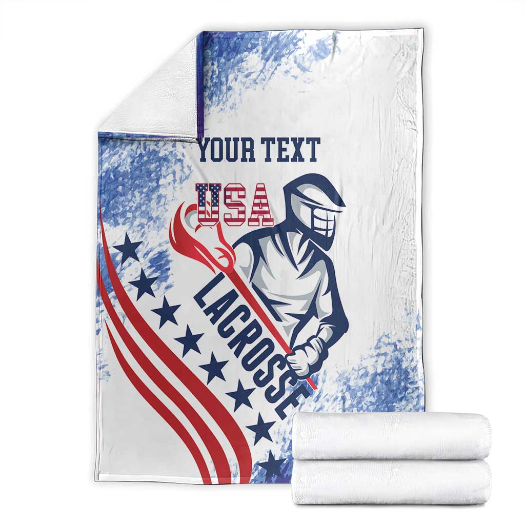 Folded custom USA lacrosse throw blanket set with two rolled layers; blue, red, white print.