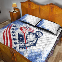 White quilt bed set with two pillow shams and blue/red lacrosse emblem design