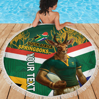 Fringed round green beach blanket showing Springboks mascot and South Africa artwork.