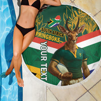 Round green fringed beach blanket featuring Springboks mascot, flag stripes, and large text.