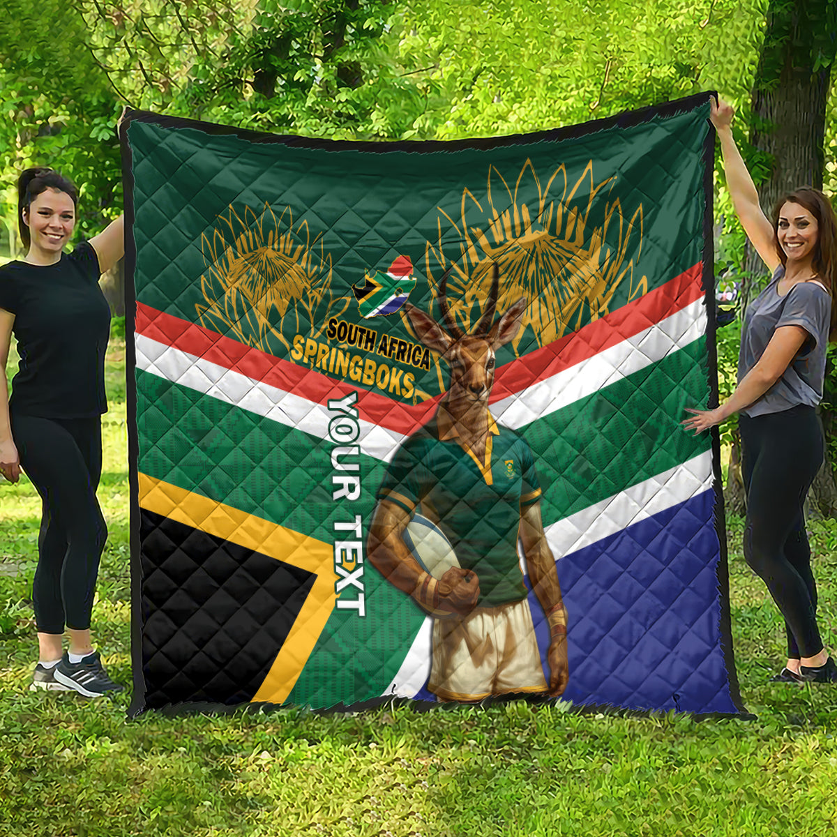 Green quilt with Springboks mascot graphic, palm-like emblem, and multicolor stripe accents.