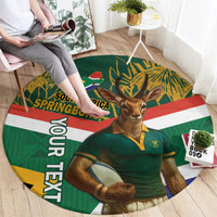 Round rug with antelope mascot in green jersey, South Africa SPRINGBOKS lettering, circular stripes.