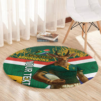 Round rugby rug with green Springboks mascot, South Africa SPRINGBOKS text, and patterned background.