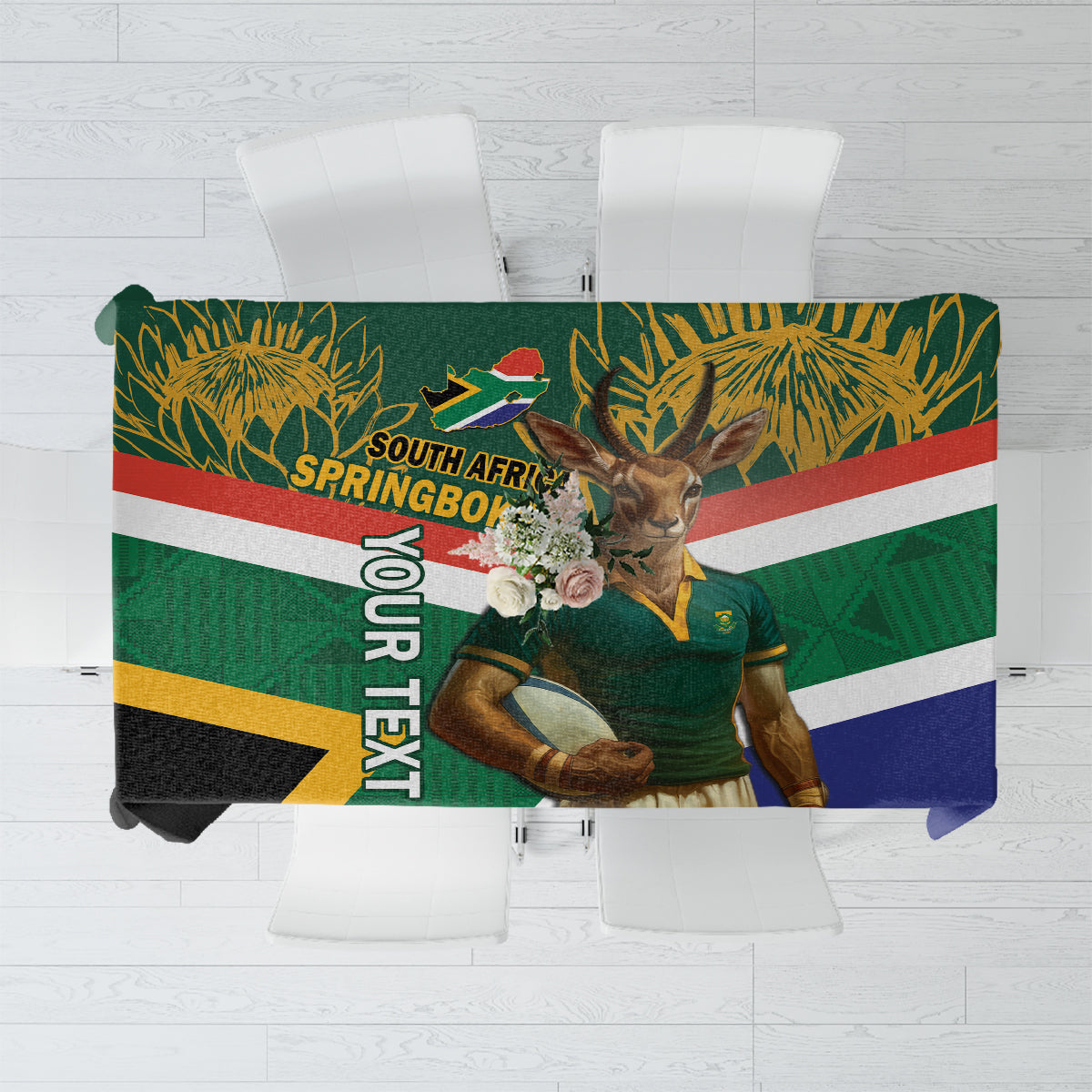 Green rugby tablecloth with Springbok mascot, flag bands, and leaf pattern center.