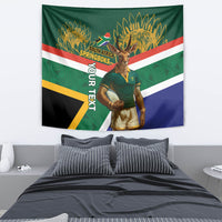 Green rugby tapestry featuring mascot holding ball with South Africa Springboks flag design