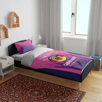 Pink and navy Germany football duvet set with logo design across the bed