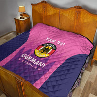 Pink and navy Germany football quilt on a bed, “YOUR TEXT” and Germany football crest