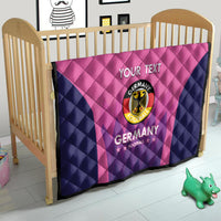 Pink and navy Germany football quilt on a bed frame, “YOUR TEXT” and Germany crest