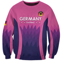 Unisex pink Germany football sweatshirt with crest and 'GERMANY' graphic front