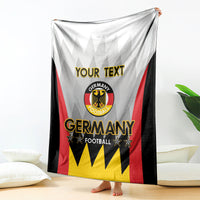 White Germany football custom blanket draped with Germany logo and “YOUR TEXT”