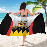 Germany football sarong draped, back view with red stripe, yellow starburst and black panels