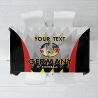 White football-themed tablecloth with Germany crest and black red yellow graphic