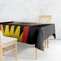 Football-themed tablecloth with black, red, and yellow zigzag stripe design