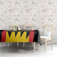 Football tablecloth with black, red, and yellow zigzag pattern on a dining set