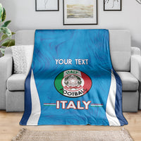 Blue Italy football blanket with white side stripes, Italy crest and custom text on couch