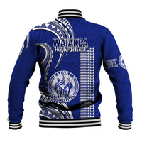 Blue baseball jacket, back view, with kakau geometric pattern and striped ribbed trim