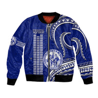 Blue bomber jacket with front zipper, black ribbed trim, white Polynesian graphic panels