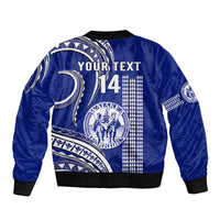 Blue bomber jacket back with YOURTEXT and 14, white Polynesian kakau graphic, ribbed hem