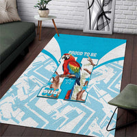 Blue area rug with white geometric pattern and proud scarlet macaw graphic