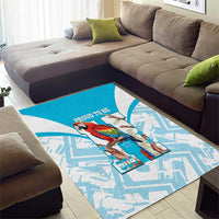 Blue area rug with white maze-like design and central macaw artwork