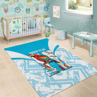 Blue area rug with white geometric pattern and macaw with “Proud to Be” text