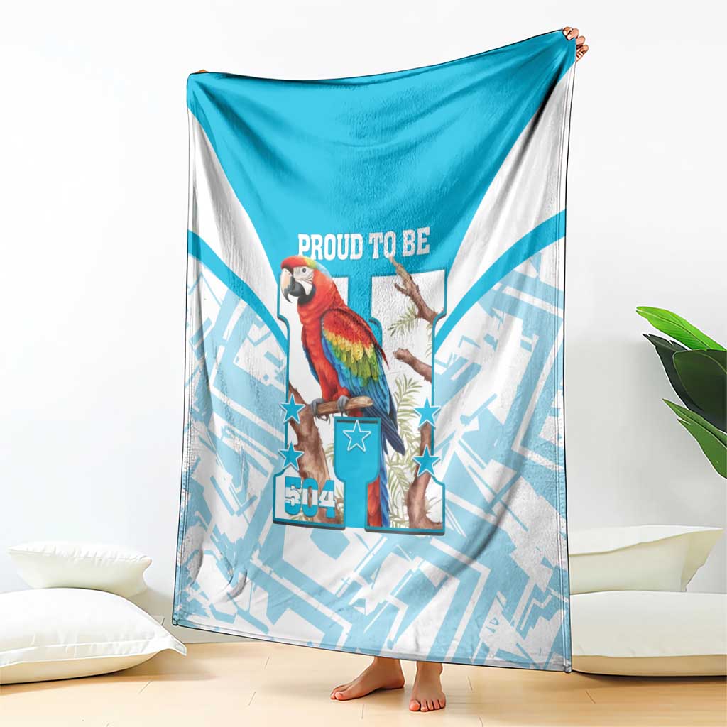Blue-and-white blanket with scarlet macaw panel, stars, and “Proud to Be 504” text