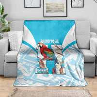 Blue-and-white throw blanket with scarlet macaw artwork, stars, and “504” logo