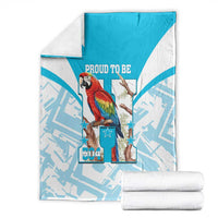 Folded blue-and-white blanket with scarlet macaw artwork, stars, and “Proud to Be 504”