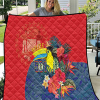 Red and blue tropical toucan quilt with floral graphics and Belize 501 emblem