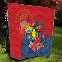 Red and blue quilt featuring toucan, large flowers, and Belize 501 title