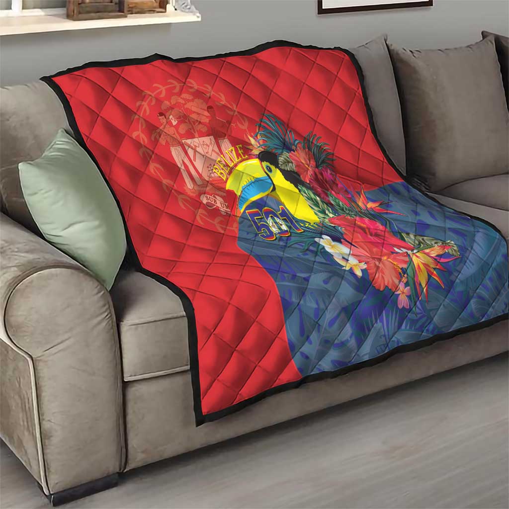 Red and blue toucan tropical quilt spread on living-room sofa