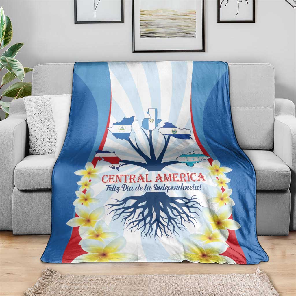 Independence Day blanket draped on a sofa with tree roots and yellow flower graphic