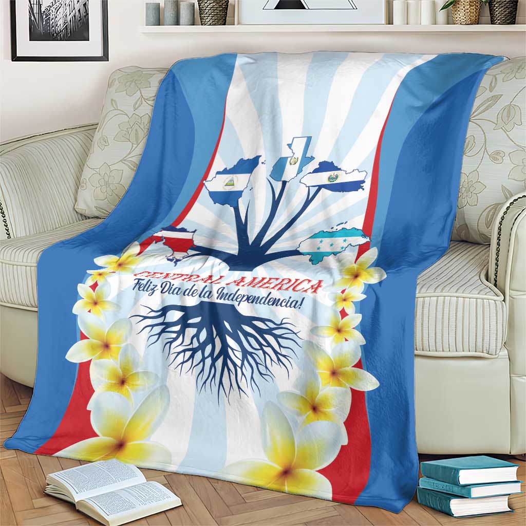 Independence Day blanket on a couch featuring tree roots, stripes, and yellow flowers