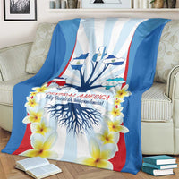 Independence Day blanket on a couch featuring tree roots, stripes, and yellow flowers