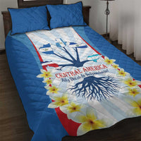 Blue quilt bed set with Central America graphic, flowers, and matching pillow shams
