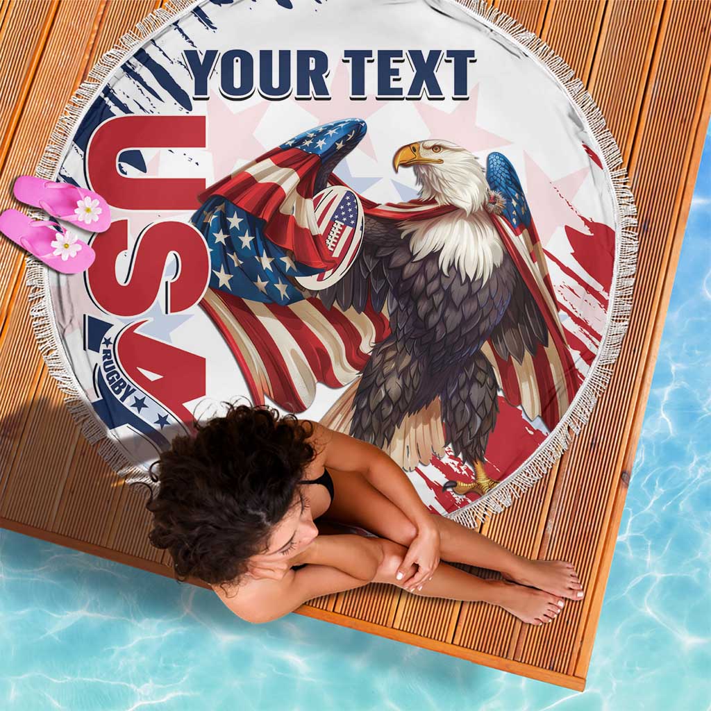 Round white beach blanket with fringe, eagle and rugby graphics, lying flat with custom text