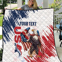 White quilt with American flag eagle graphic and quilted diamond pattern, text area.