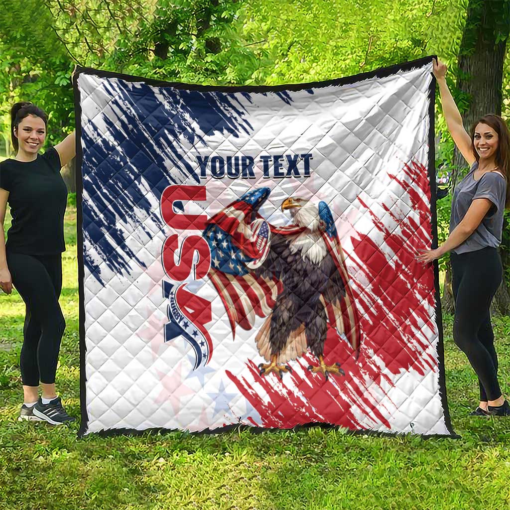 Large white quilt featuring American flag eagle graphic with quilted diamond stitching.