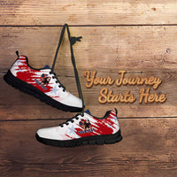 White sneaker with red eagle grunge stripe and star pattern, lace-up, black outsole.