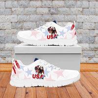 White lace-up sneakers with USA eagle and star print, red grunge stripe, outsole visible.
