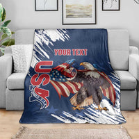 Blue eagle rugby blanket on gray sofa, grunge streaks and “YOUR TEXT” print.