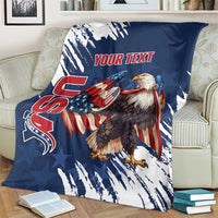 Blue eagle blanket on patterned armchair with grunge streaks and “YOUR TEXT” print.