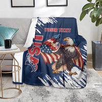 Blue eagle blanket on gray couch with patriotic graphic, grunge streaks, “YOUR TEXT”.