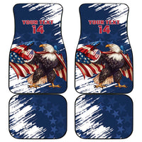 Set of blue car mats with eagle and stars; red 'YOUR TEXT 14' on two mats.